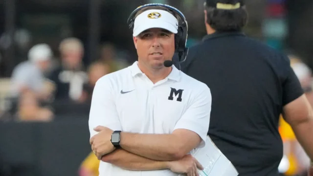 Missouri football team practicing communication drills under simulated cowbell noise to prepare for the hostile environment at Davis Wade Stadium in Starkville